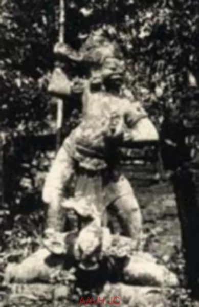 A stone dvarapala guardian standing on a buffalo at Dong Duong, photographed in 1930.